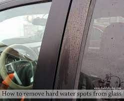remove hard water spots from glass