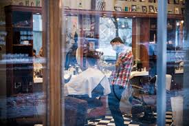 barber cutting customer s hair stock photo