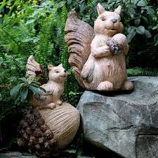 large squirrel with pine cones statue