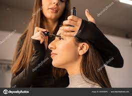 makeup artist applies natural makeup