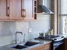 Where should a stove be placed in a kitchen?
