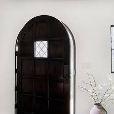 Arched Dark Wood Paneled Front Door