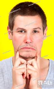 sad man making unhappy face with hands