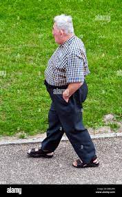 Obese man walking hi-res stock photography and images - Alamy