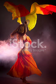 belly dancer with colorful fan veils