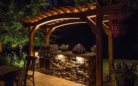outdoor stone kitchen pergola lighting