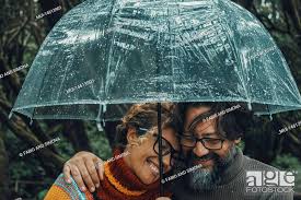 romantic couple in love under umbrella