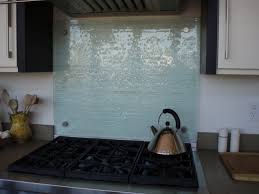 Ceramic tiles are popular behind a stove. Fusion Glass Backsplash Behind Range