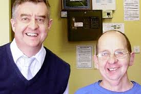 Specsavers hearing aid director Colin Bainbridge, left, with Dale kitman Jack Northover after fitting him out with his new hearing aid - C_71_article_1241645_image_list_image_list_item_0_image-583728