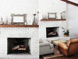Wood Mantel On White Brick Fireplace