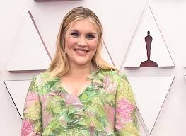 New mom emerald fennell, best director nominee for promising young woman, smiled bright in a flowing spring green and lilac gown. Kfkxtarstozsbm
