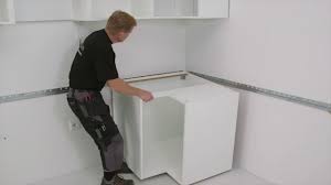Be sure to use a level to assure this line will be true horizontal. Ikea Metod Kitchen Installation 3 7 Installing The Cabinets Ikea Australia Youtube