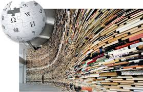 Wikipedia logo superimposed in corner of curving library shelf