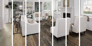Inspiration for a transitional enclosed medium tone wood floor and brown floor living room remodel in kansas city with white. One Living Room Seven Ways Living Room Hardwood Flooring Ideas