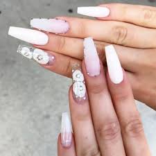 One of the accent nails is covered in sparkling crystals. The Most Stylish Ideas For White Coffin Nails Design White Nail Designs Coffin Nails Designs Ballerina Nails