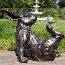 Bird Sitting On Rabbit Garden Sculpture