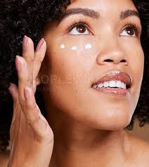 young black woman skincare cream and