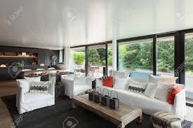 Modern Living Room With White Divans And Big Windows