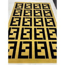 fendi carpets are golden and black فندي