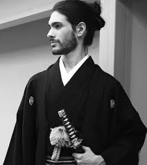 Samurai japanese long hairstyles male. A Photograph Of A White Samurai Male With A Cool Chonmage Hairstyle Which Is Also Known As A Topknot Hairstyle For His Long Dark Hair As He Stands Up With His Sword