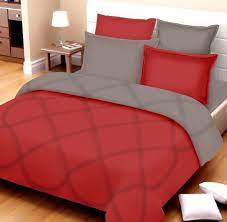 red and white hotel style bed sheets