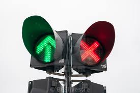 Traffic Light With Red Cross And Green Arrow Turned On