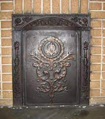 Use Old Iron Fireplace Cover On Wall