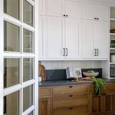 white upper cabinets and brown lower
