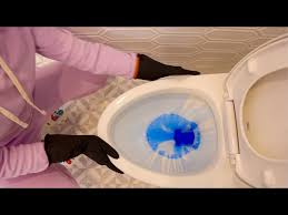 cleaning a toilet