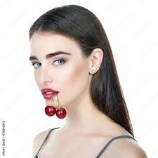 young beautiful woman with ripe cherry