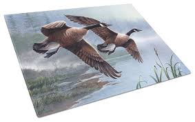 geese on the wing glass cutting board