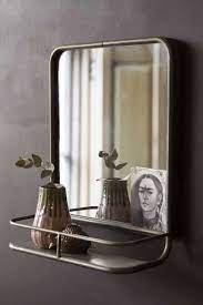 This fabulous champagne color frame has a nice classy look. Antique Silver Almost Square Bathroom Mirror With Shelf Rockett St George