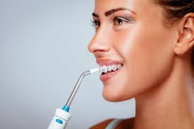 how to use water flosser for teeth