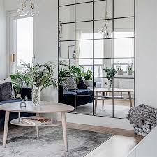 a mirror wall feature for a living room