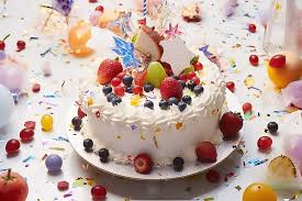 a white birthday cake decorated with