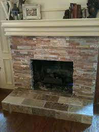 free tile over brick fireplace