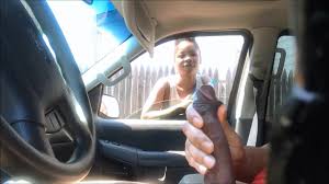 Cute black hooker checks out his stroking in the car voyeurstyle