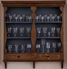 A Wall Mounted Dresser Top For Glasses