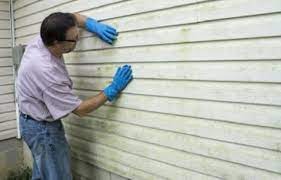 1 of 3 eugene dallas stands in front of the siding on his home in wilton, n.y., march 8, 2012. How To Remove Oil Based Stain From Vinyl Siding Ultimate Guide