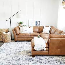 Classic english style sofa upholstered in brown leather with nail heads and camel shape back and sides. 8 Ideas To Make A Dreamy Camel Colored Room Daily Dream Decor