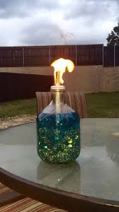 Diy Tiki Torch I Placed Beads In The Bottle Of An Apple