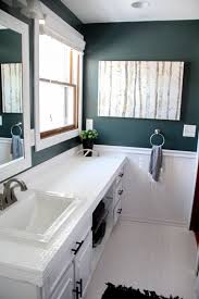 You can fix small cracks with epoxy glue, but larger repairs may call for replacement of one or you can often find epoxy putty in colors, and you may come across one that matches your tiles, but if not, you can always paint the repair with enamel paint. How To Paint Tile Countertops And Our Modern Bathroom Reveal Bright Green Door