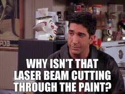 laser beam cutting through the paint