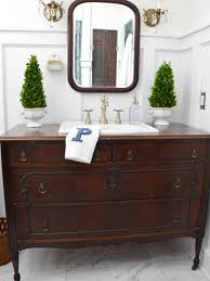 A metal barrel is great to add a little industrial touch to the bathroom. Turn A Vintage Dresser Into A Bathroom Vanity Hgtv