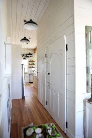 Joanna Gaines Age With Farmhouse Hall And Kitchen Pendant Lighting White Doors White Paneling Finefurnished Com