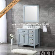 Solid wood vanity, glass vessel sink, faucet, supply lines, & drain and mirror. China 36 Single Sink Wholesale Solid Wood Bathroom Vanity China Bathroom Mirror Cabinet Bathroom Cabinet Storage