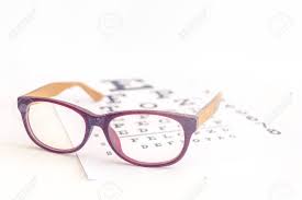 Close Up Of A Eyeglasses On Eye Chart Background Myopia Or