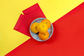 Check out this fantastic collection of chinese new year wallpapers, with 43 chinese new year background images for your desktop, phone or tablet. Chinese New Year Oranges And Red Angpao Pocket On Bright Yellow And Red Paper Background Stock Photo Adobe Stock