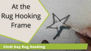 at the rug hooking frame you