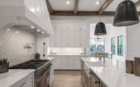 Clean white kitchen cabinets with black hardware in a minimalist kitchen. White Kitchen Cabinet Ideas Beautiful Cabinetry Designs